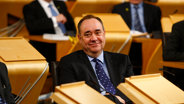 Former First Minister Alex Salmond sitting in the Debating Chamber