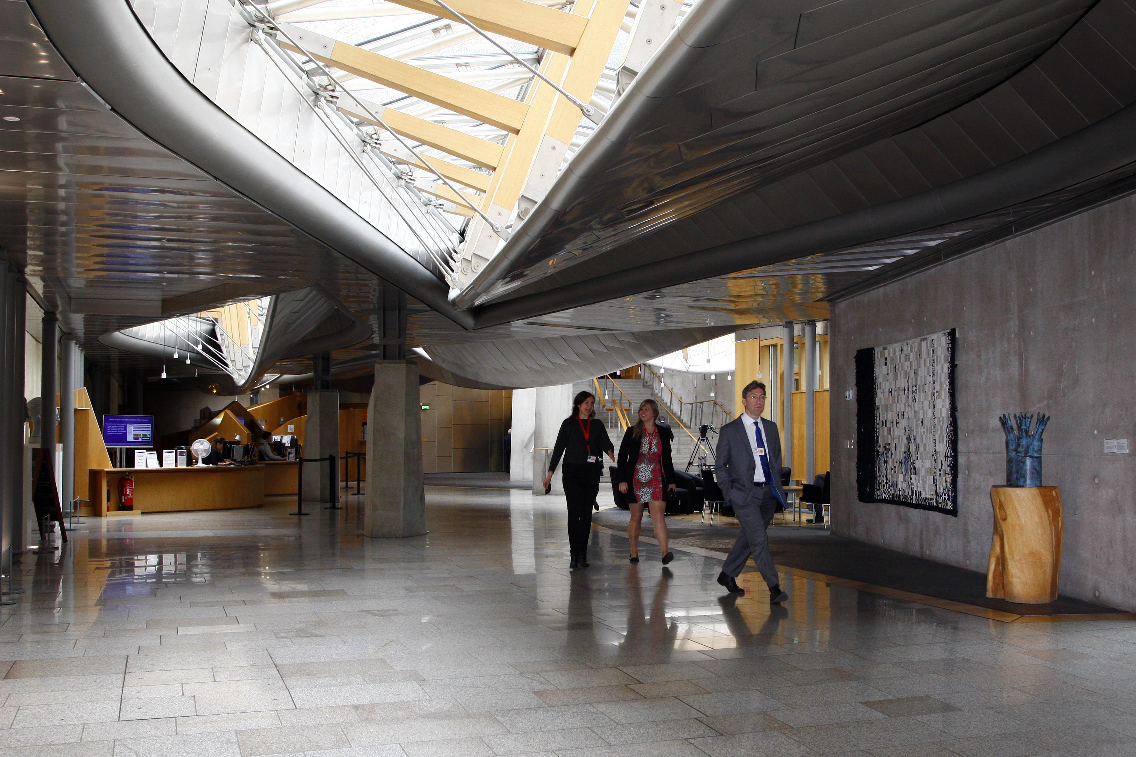 The Garden Lobby in the Scottish Parliament. There are large oval glass windows in the roof.