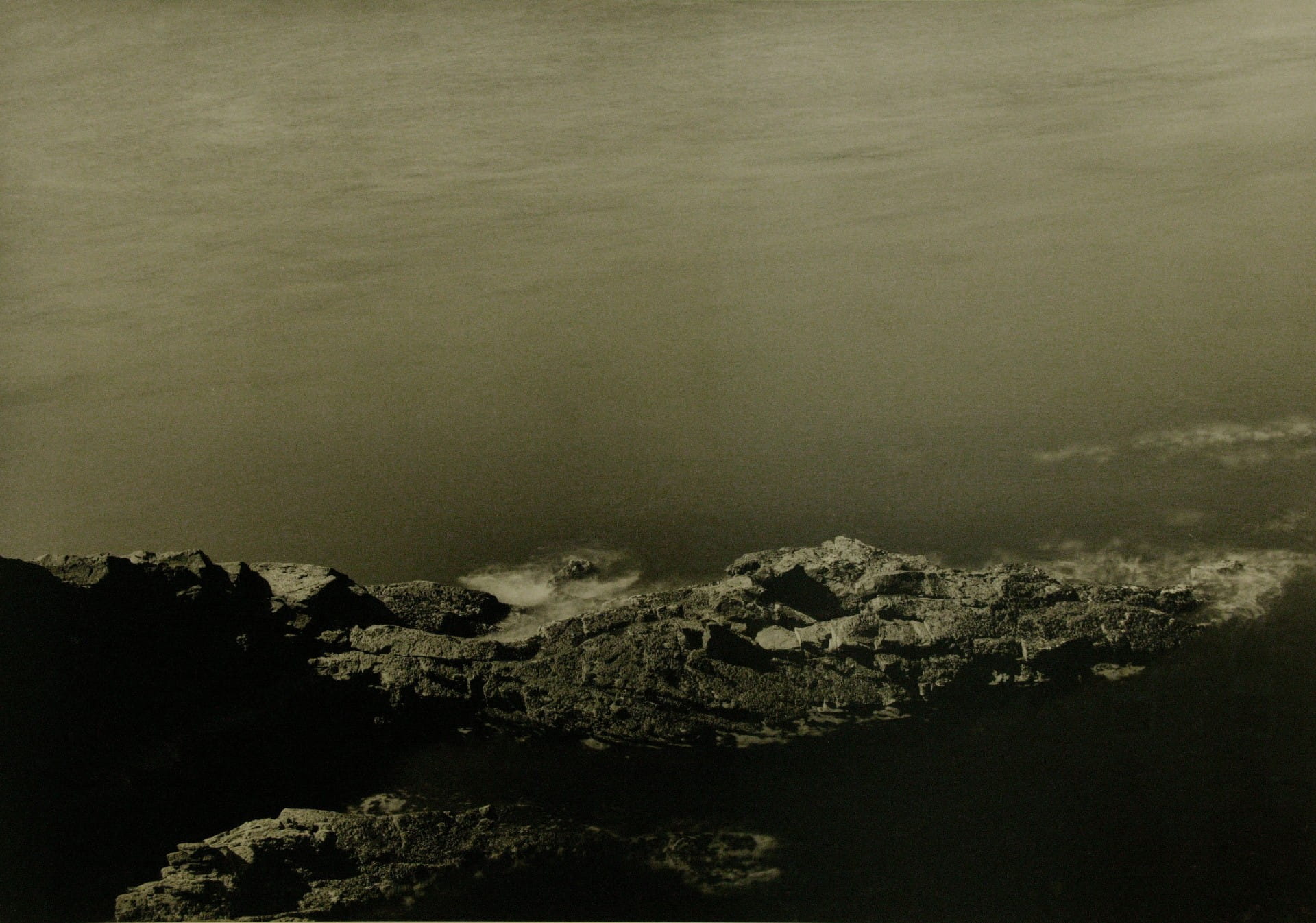 Black and white photograph of the sea.