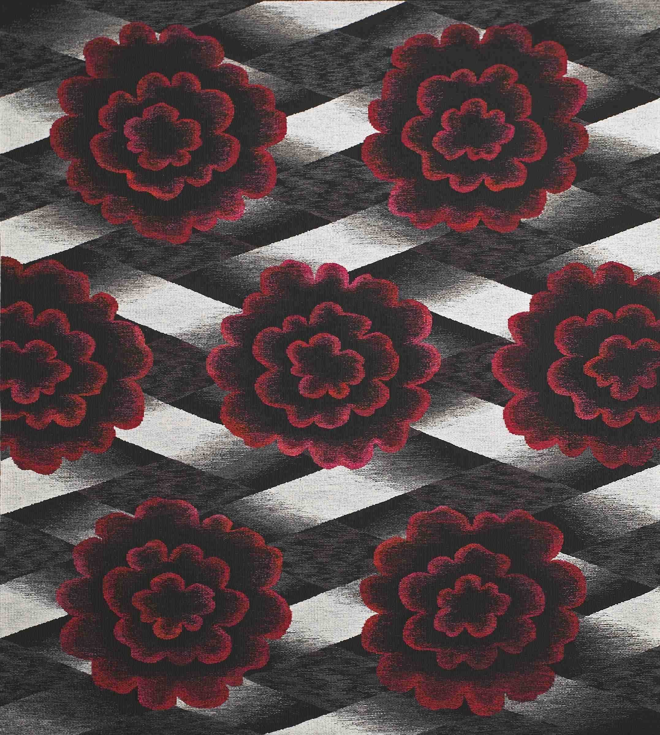 Large woven tapestry in red, black and white featuring an abstract pattern of large roses.