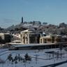 The Scottish Parliament and Calton Hill covered in snow